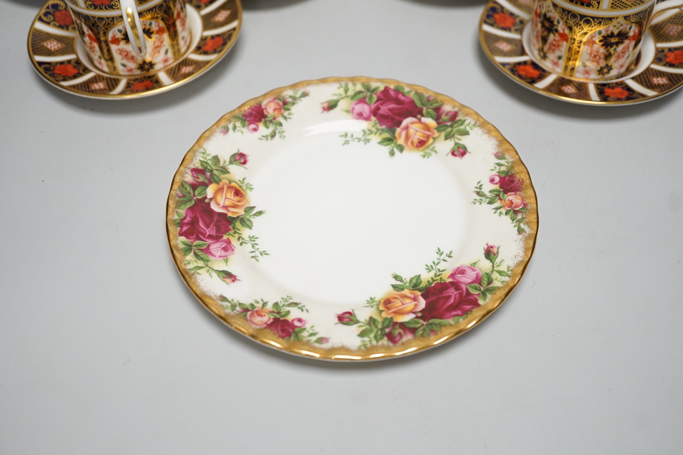 Six Royal Crown Derby coffee cans and saucers and a Royal Albert Country Roses dish and cover